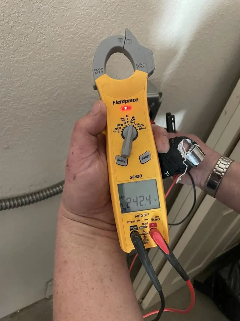 Voltage testing with clamp meter during Outlet Installation in Riverdale